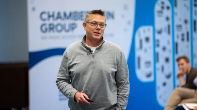 Chamberlain Group executive presenting on stage at an internal innovation summit briefing