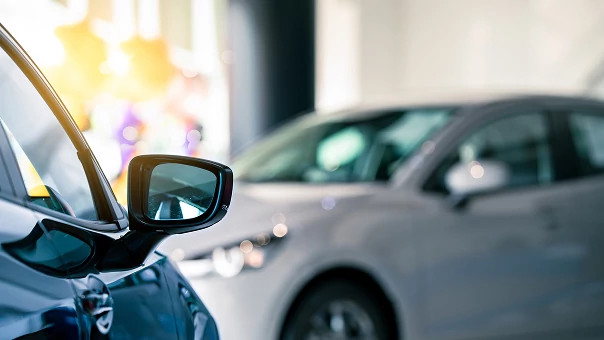 Image of car referencing a dealership, representing secure, cloud-based access control for automotive facilities