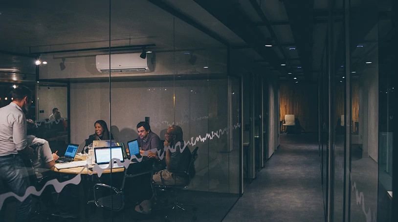 Office meeting room view, highlighting collaborative decision-making around commercial access control solutions