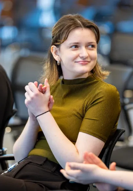 Smiling female intern listening during an active session at Chamberlain Group