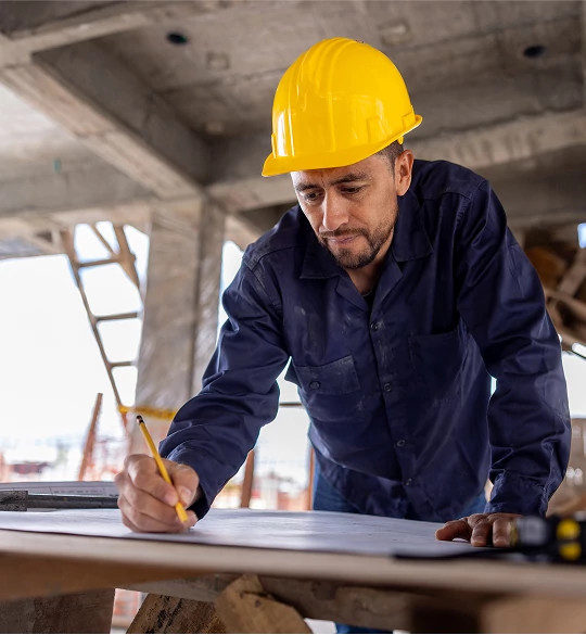 Construction worker in yellow helmet, symbolizing support for builders and integrators using myQ smart access solutions
